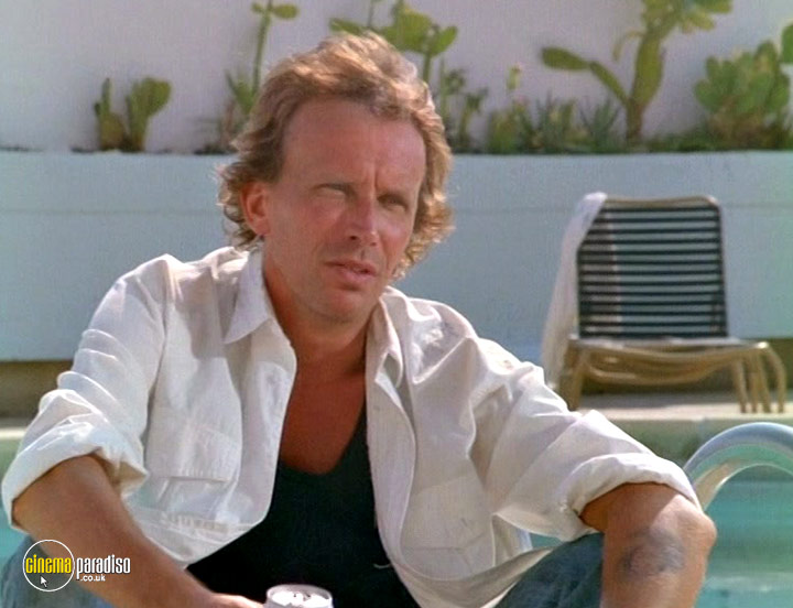A still #15 from Cat Chaser (1989)
