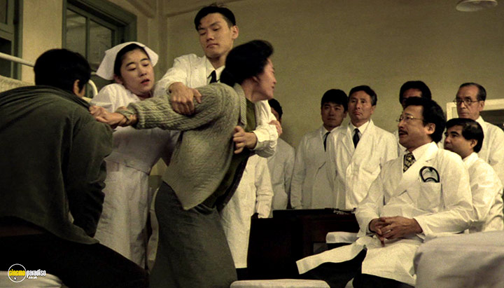 A still #8 from The Sting of Death (1990)