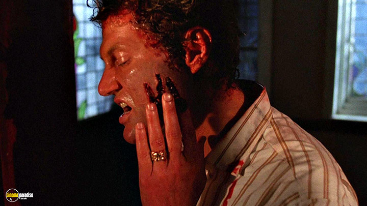 A still #114 from Hellraiser (1987) With Andrew Robinson