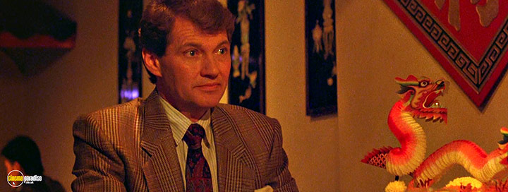 A still #115 from Hellraiser (1987) With Andrew Robinson